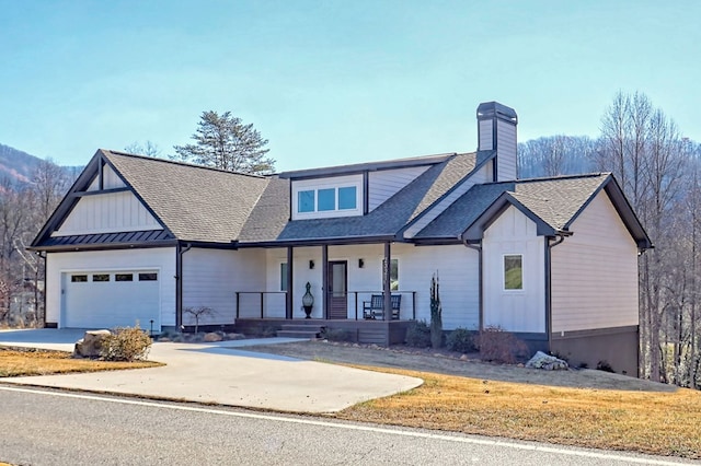 view of front of house featuring a porch and a garage