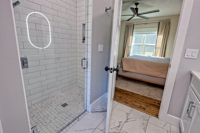 bathroom with ceiling fan, wood-type flooring, a shower with door, and vanity