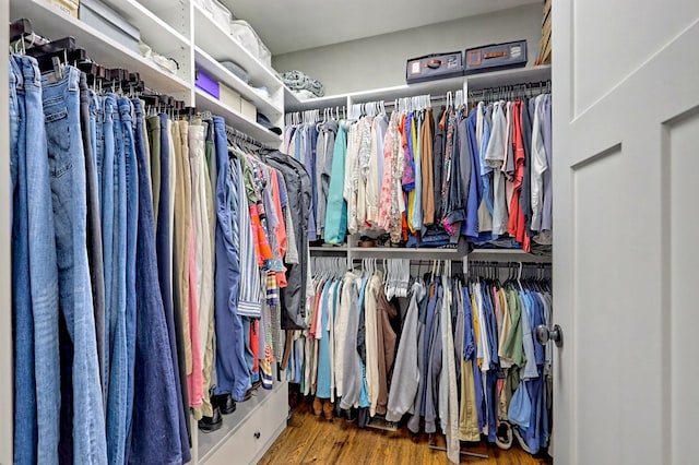 walk in closet featuring dark wood-type flooring