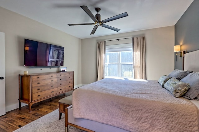 bedroom featuring dark hardwood / wood-style flooring and ceiling fan