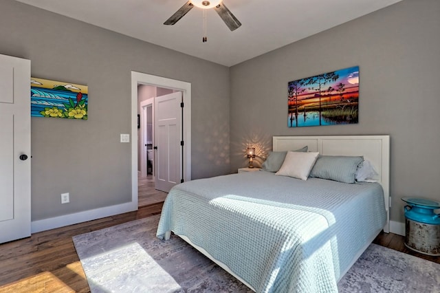 bedroom with ceiling fan and dark wood-type flooring