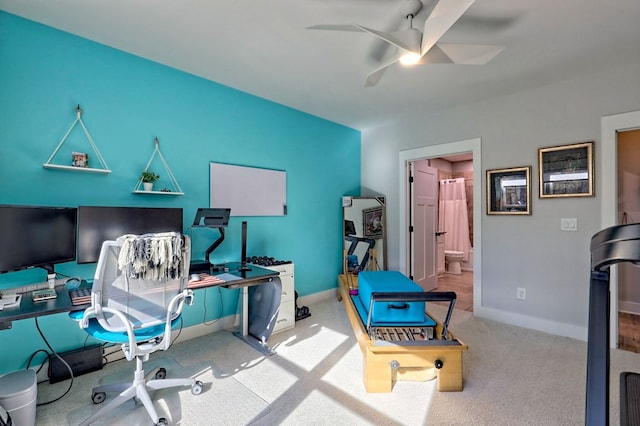 office space with ceiling fan and light colored carpet