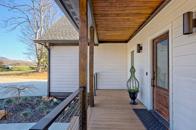 wooden deck with a mountain view