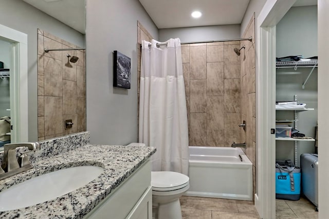 full bathroom with toilet, shower / bath combo, vanity, and tile patterned floors