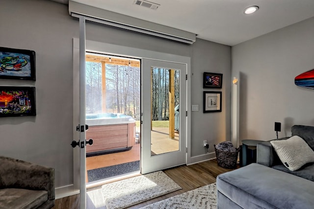 doorway to outside featuring dark wood-type flooring and french doors