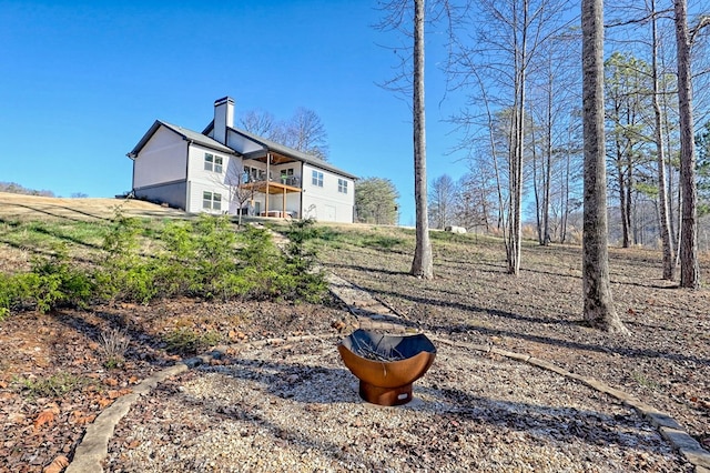 rear view of house featuring a deck