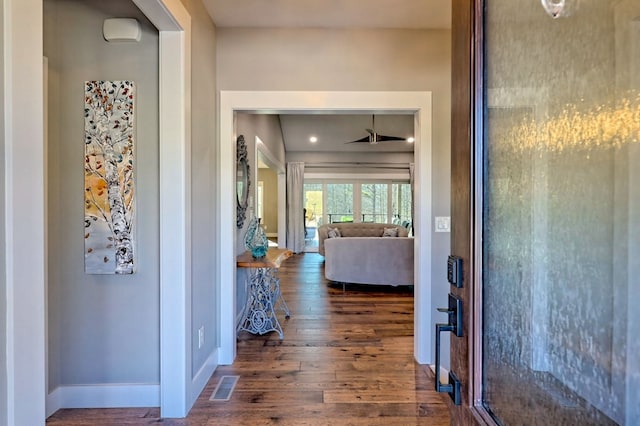 hall featuring dark wood-type flooring