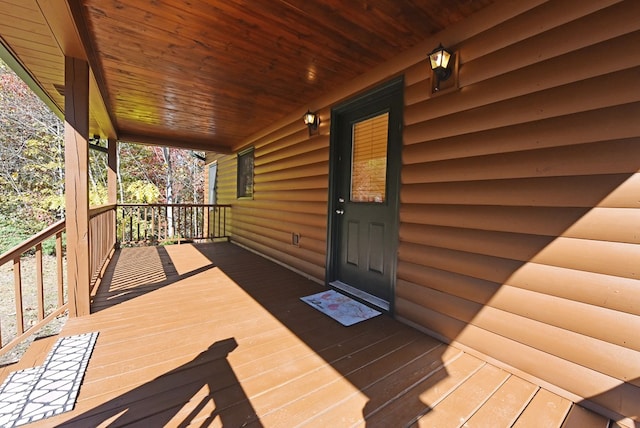 wooden terrace with a porch