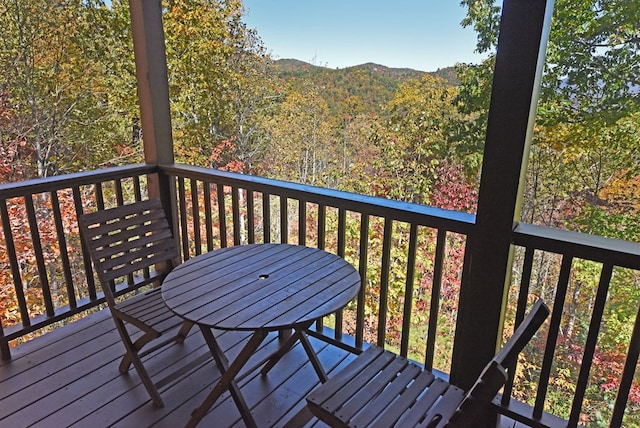 wooden deck with a mountain view