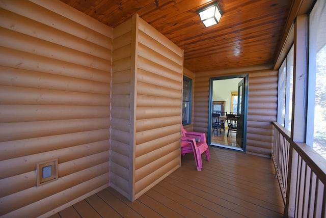 unfurnished sunroom featuring wooden ceiling