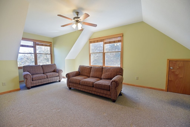 carpeted living room featuring ceiling fan, a healthy amount of sunlight, and lofted ceiling