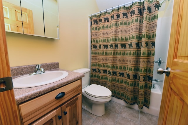 full bathroom with tile patterned flooring, shower / tub combo, vanity, and toilet