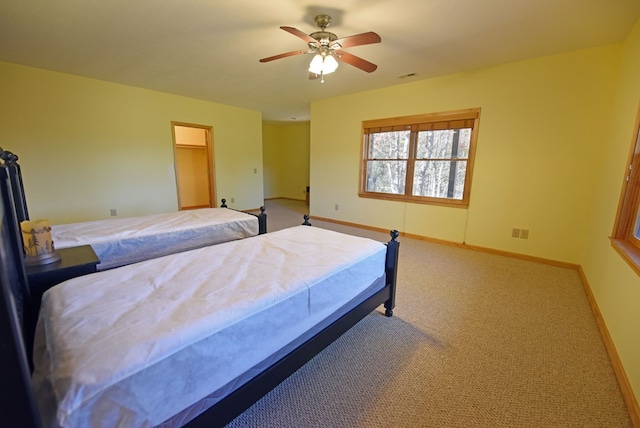 bedroom featuring ceiling fan and carpet floors