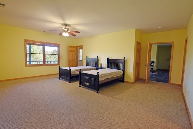 carpeted bedroom featuring ceiling fan