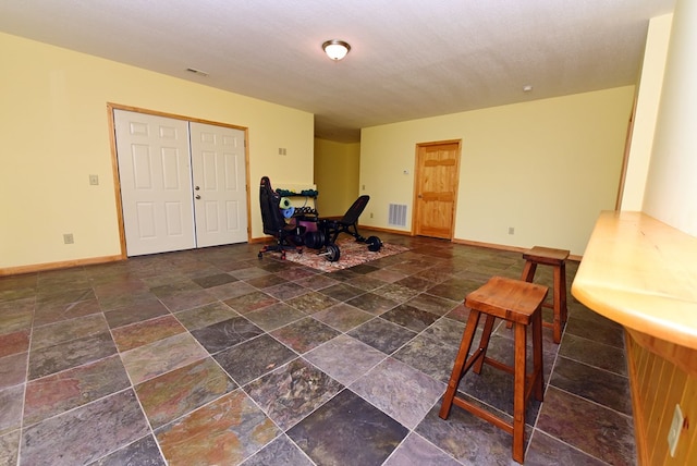 foyer with a textured ceiling