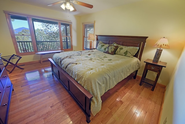 bedroom with hardwood / wood-style floors and ceiling fan