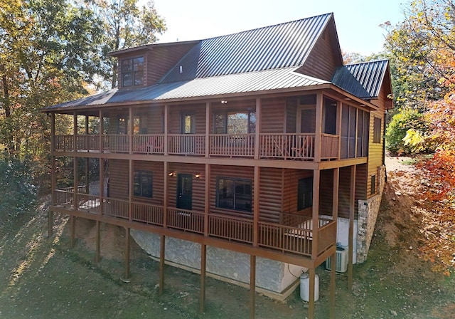 rear view of house with central AC