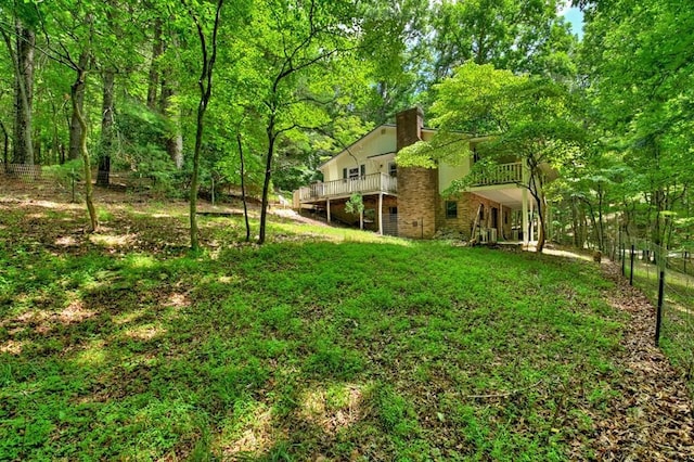 view of yard featuring a wooden deck