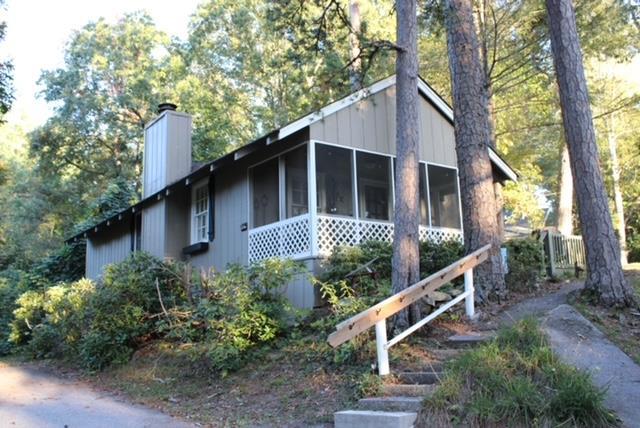 view of side of home featuring a sunroom