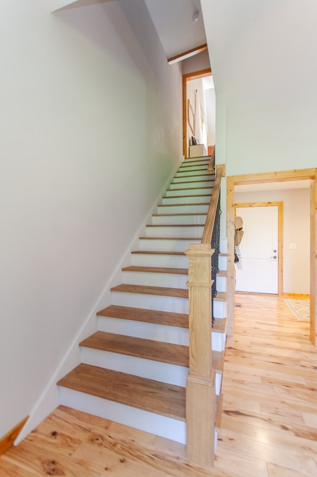 stairway featuring hardwood / wood-style floors