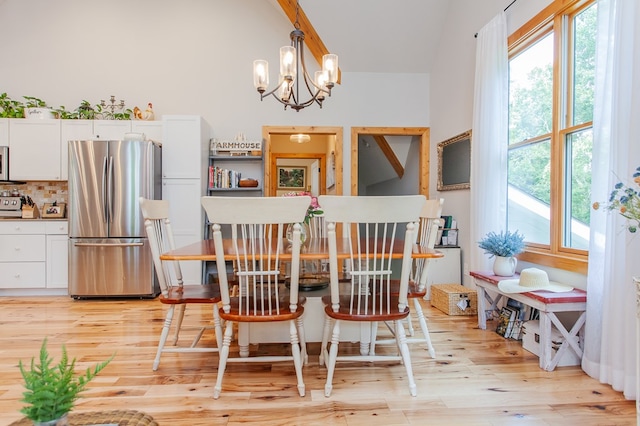 dining room with a notable chandelier and light hardwood / wood-style floors