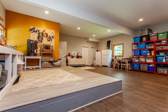 interior space with hardwood / wood-style floors and beam ceiling