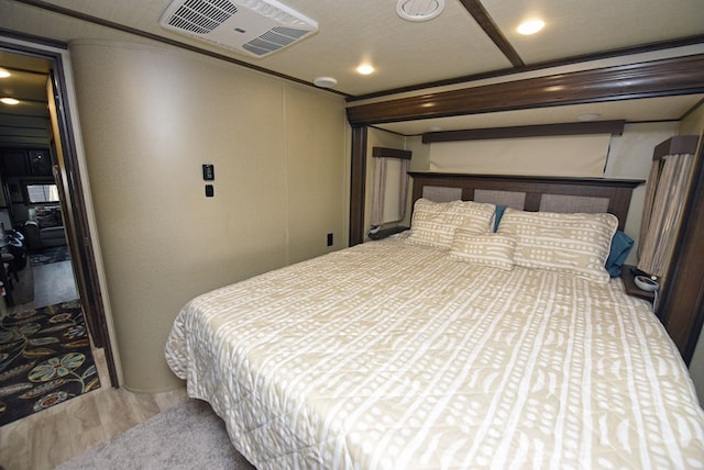 bedroom featuring wood-type flooring