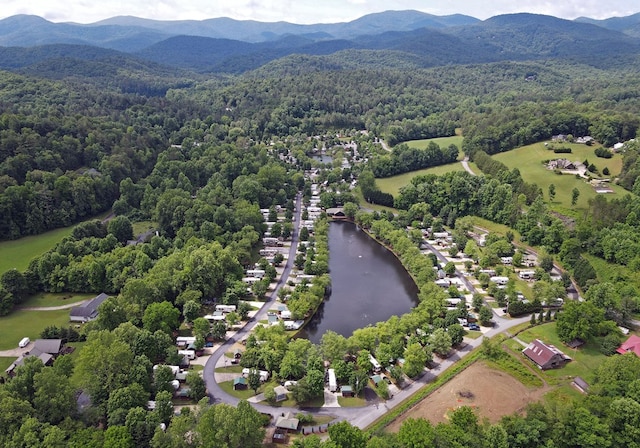 bird's eye view with a water and mountain view