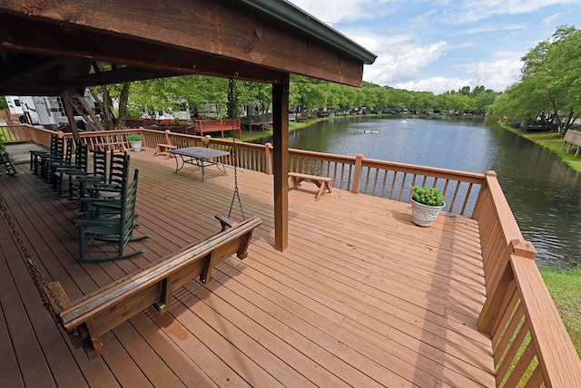 wooden deck with a gazebo and a water view