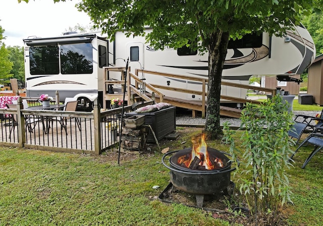 view of yard with a fire pit