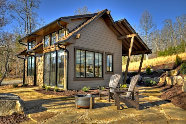 rear view of property featuring a patio area