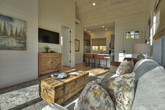 living room with recessed lighting, high vaulted ceiling, wood walls, and wooden ceiling