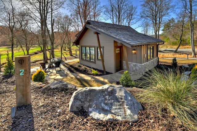 view of property exterior featuring stone siding