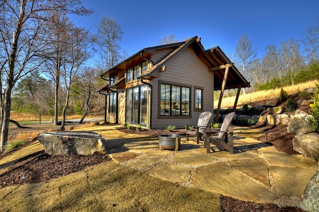 rear view of property with a patio area