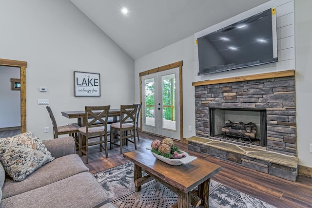 living room with french doors, a fireplace, dark hardwood / wood-style floors, and high vaulted ceiling