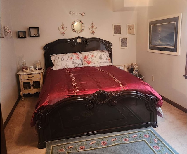 carpeted bedroom with baseboards