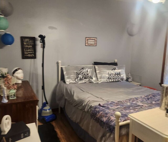 bedroom featuring wood finished floors
