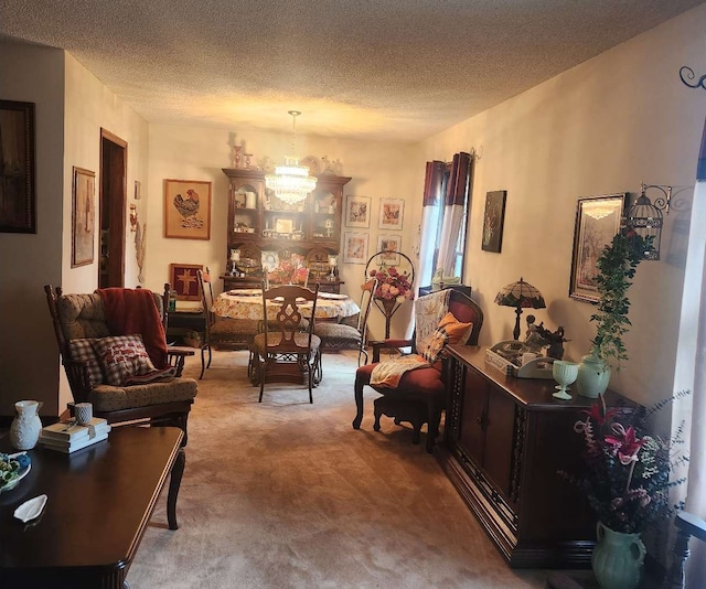 living room with carpet floors, a chandelier, and a textured ceiling