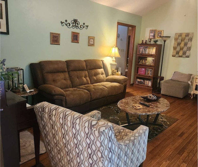 living area featuring wood-type flooring and lofted ceiling