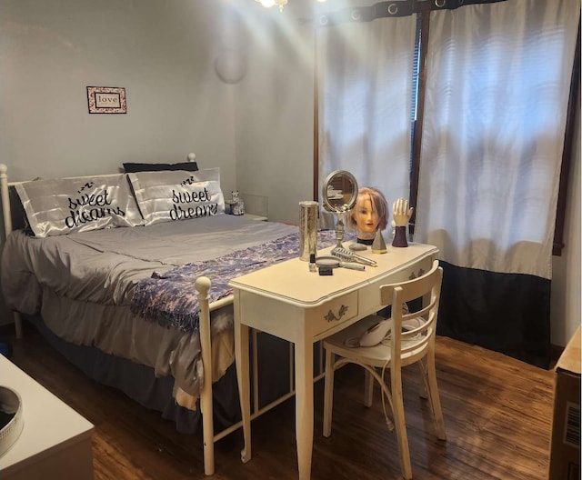 bedroom featuring wood finished floors