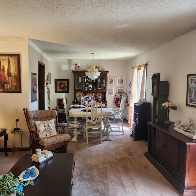 dining area with carpet flooring, a textured ceiling, a chandelier, and ornamental molding