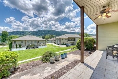 view of patio / terrace featuring a mountain view and ceiling fan