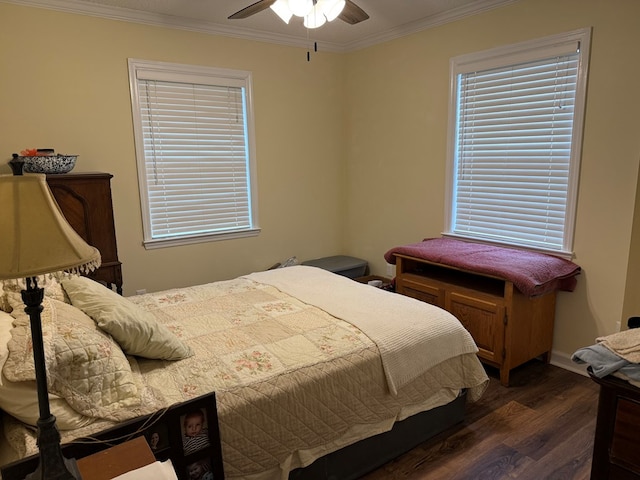 bedroom with dark wood-type flooring, ceiling fan, and ornamental molding