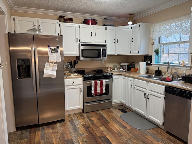 kitchen featuring stainless steel appliances, sink, and white cabinets