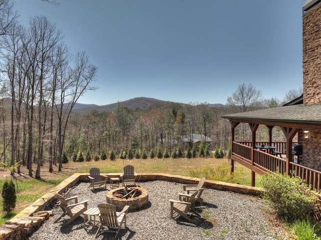 view of yard with an outdoor fire pit