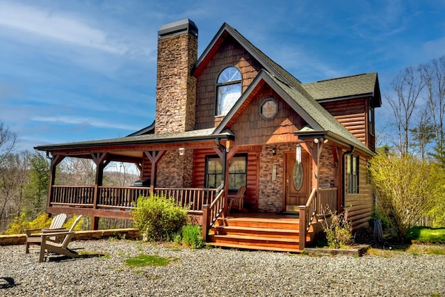 log cabin featuring a porch