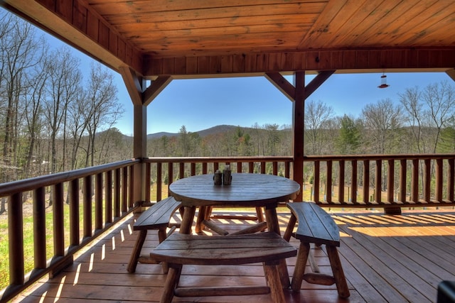 wooden deck featuring a mountain view