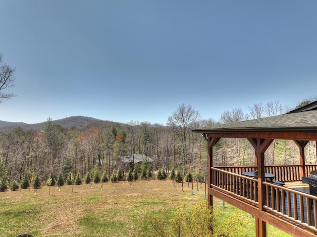 view of yard with a wooden deck