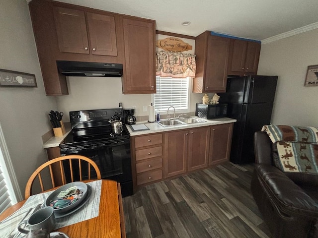 kitchen with dark hardwood / wood-style flooring, sink, black appliances, and ornamental molding