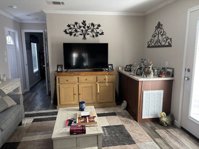 living room featuring dark wood-type flooring and ornamental molding